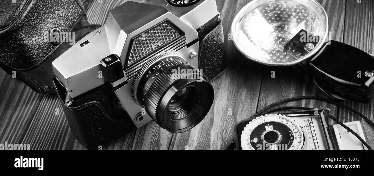 Old vintage film photo camera, flash and exposure meter Stock Photo Alamy