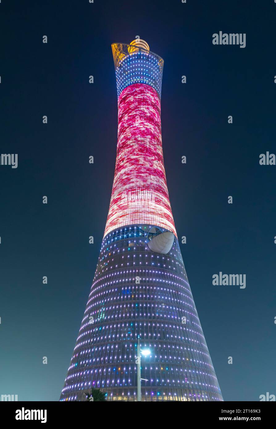Illuminated Torch Tower aka Aspire Tower by night, Doha, Qatar Stock