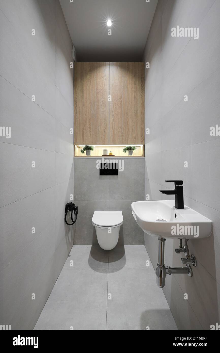 White toilet bowl with washbasin in a modern bathroom interior Stock ...