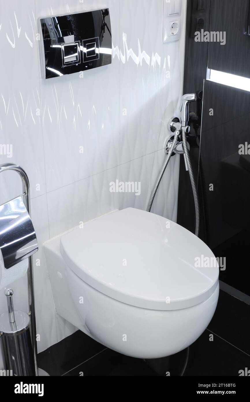 White toilet bowl in a modern interior toilet room Stock Photo - Alamy