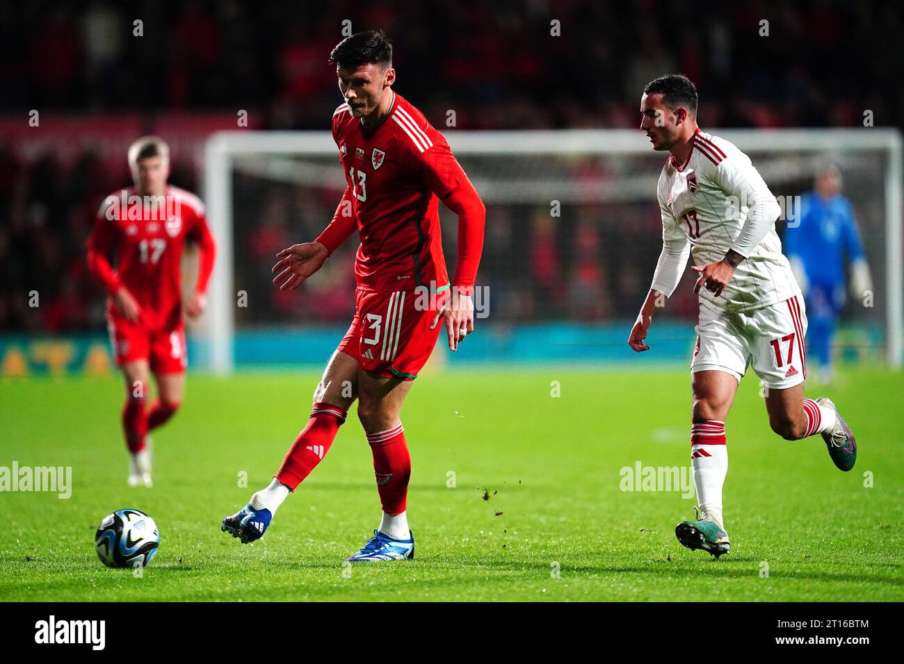 Wales' Kieffer Moore and Gibraltar's Kian Ronan battle for the ball during an international friendly match at the SToK Racecourse, Wrexham. Picture date: Wednesday October 11, 2023. Stock Photo