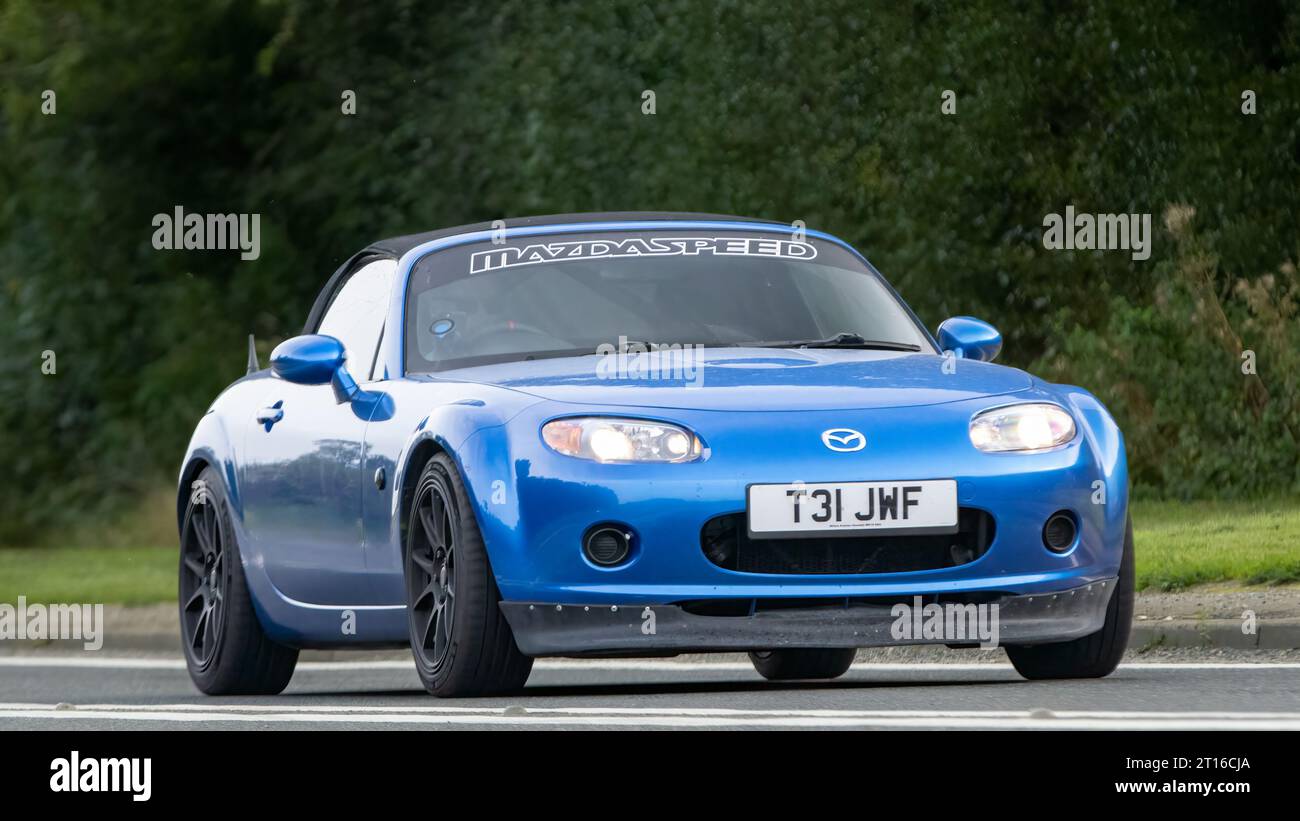 Bicester,Oxon.,UK - Oct 8th 2023: 2006 blue Mazda MX 5  classic car driving on an English country road. Stock Photo