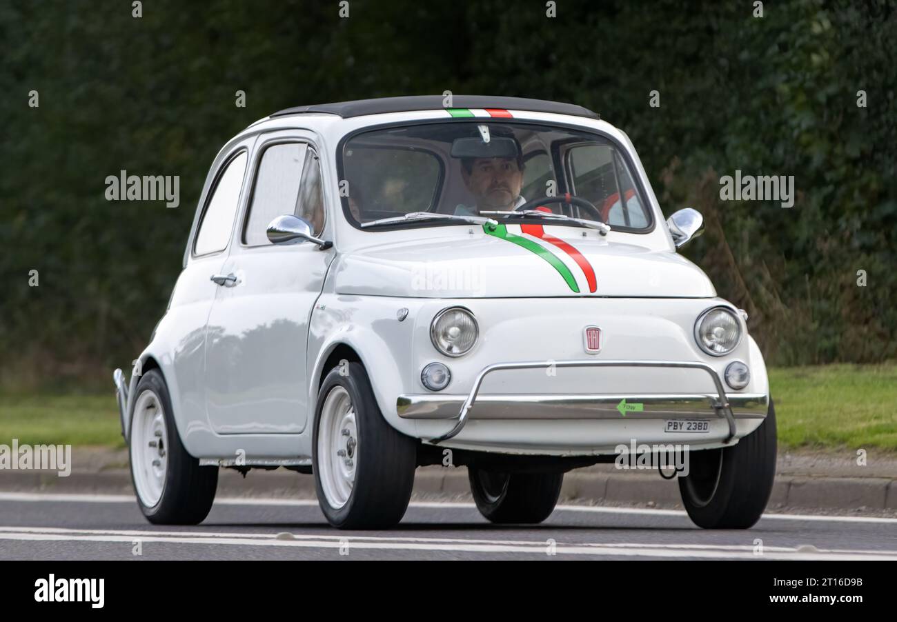Bicester,Oxon.,UK - Oct 8th 2023: 1966 white Fiat 500 classic car driving on an English country road. Stock Photo