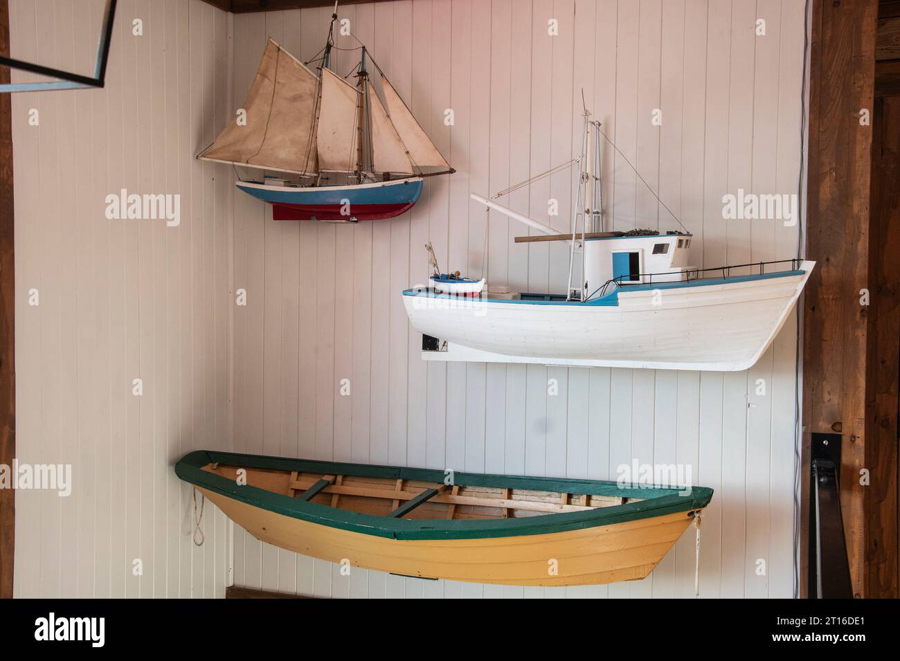 Display of a sailboat, fishing boat and dory inside the Dildo Brewing Company in Newfoundland & Labrador, Canada Stock Photo