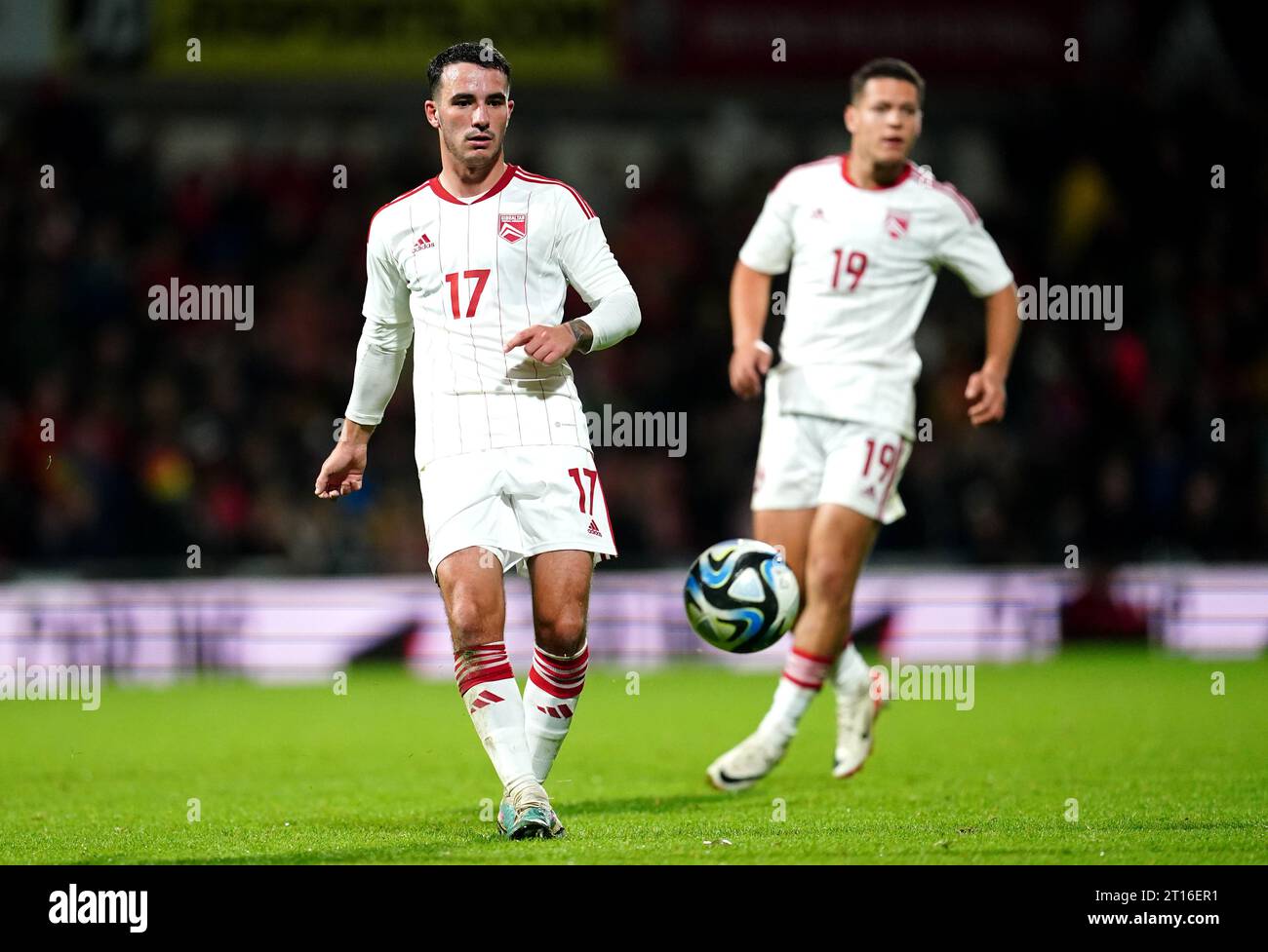 Gibraltar's Kian Ronan (left) and Tjay De Barr during an international friendly match at the SToK Racecourse, Wrexham. Picture date: Wednesday October 11, 2023. Stock Photo