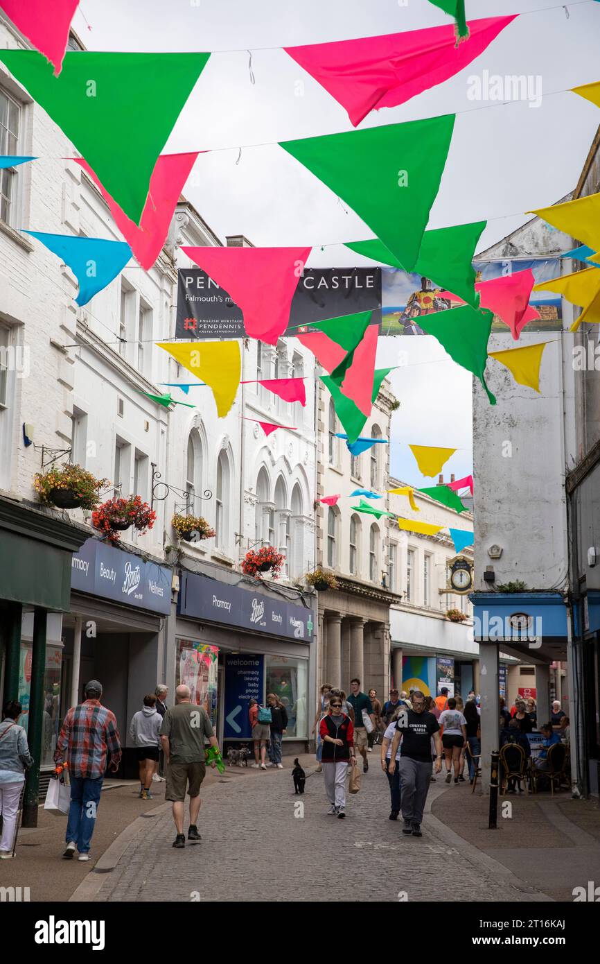 September 2023, shopping in Church street Falmouth Cornwall, street bunting on display and rows of independent shops,England,UK Stock Photo