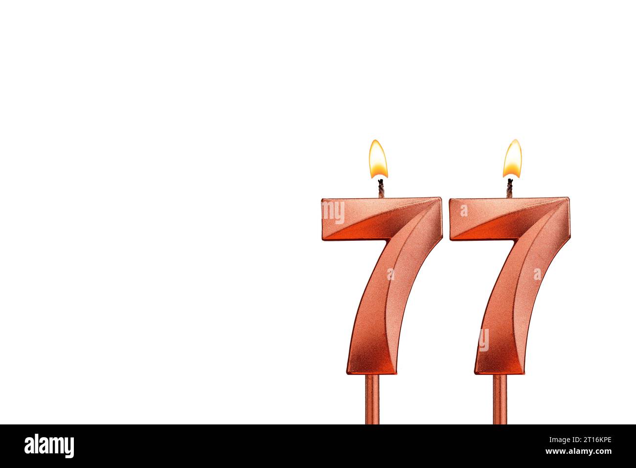 Birthday candle number 77 on white background Stock Photo