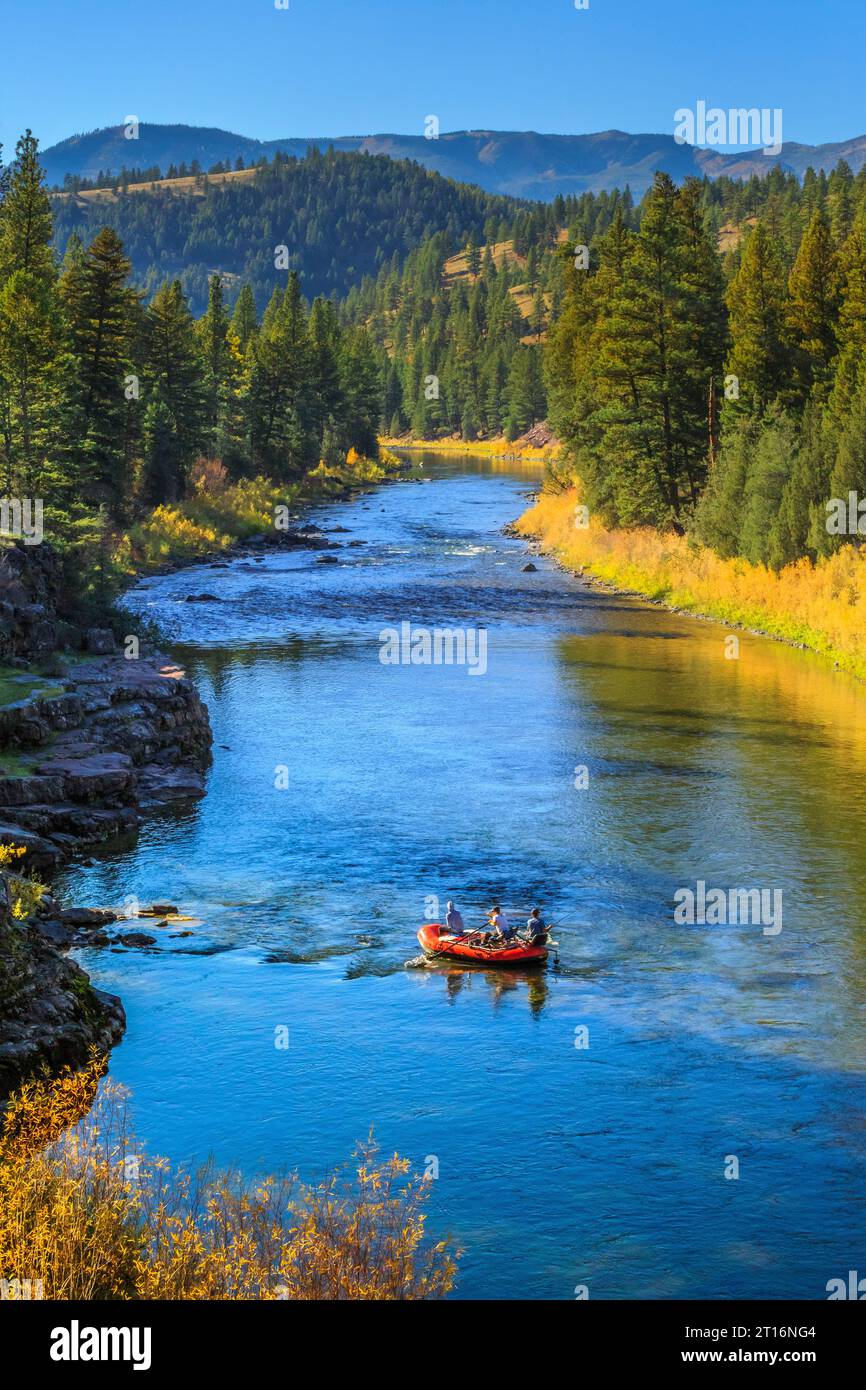boaters floating down the blackfoot river in autumn near potomac