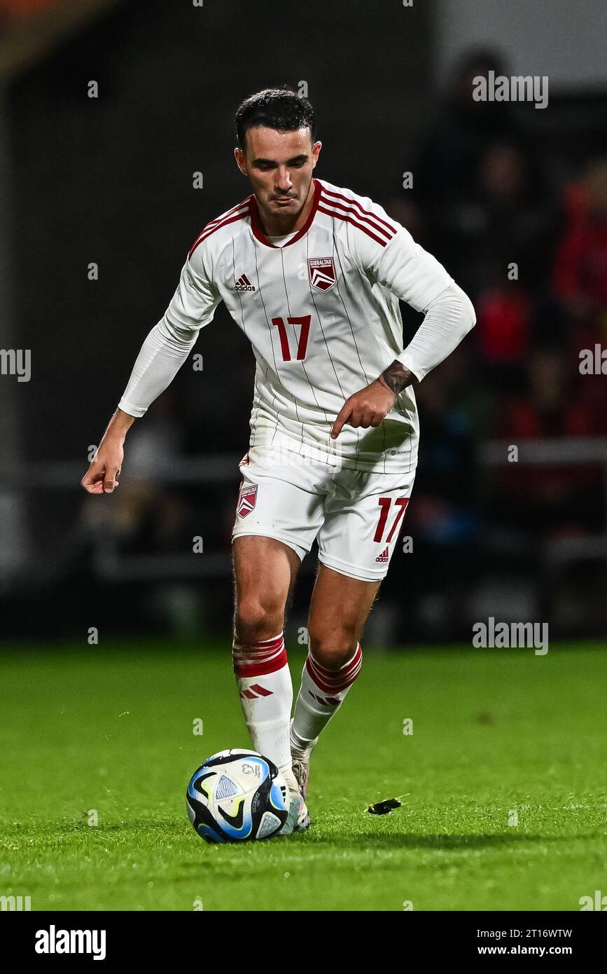 Kian Ronan of Gibraltar makes a break with the ball during the International Friendly match Wales vs Gibraltar at SToK Cae Ras, Wrexham, United Kingdom, 11th October 2023  (Photo by Craig Thomas/News Images) Stock Photo