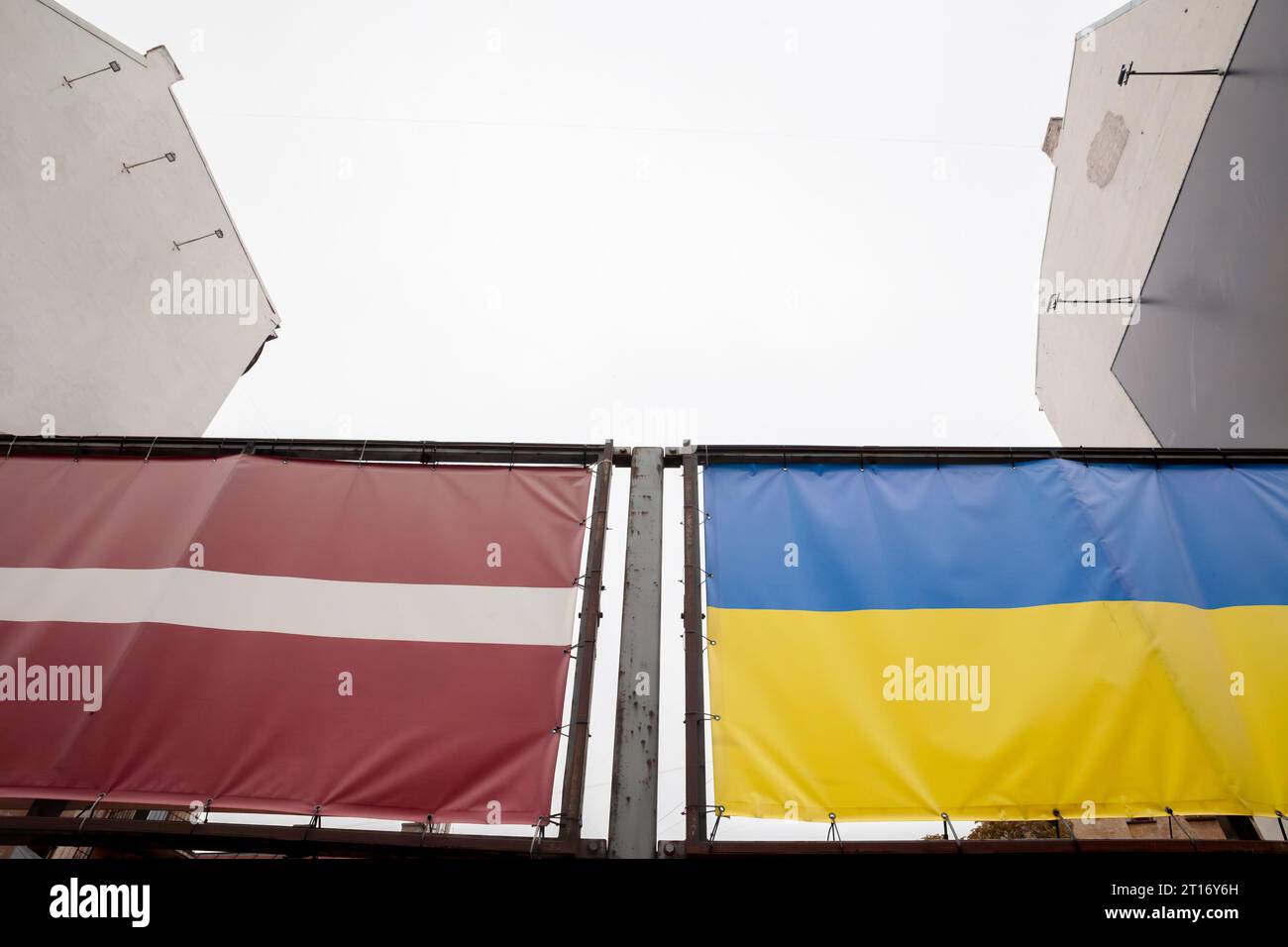 Picture of the dutch and Latvian flags waiving together in Riga, celebrating the solidarity between Latvia and Ukraine in the war against russia. Stock Photo
