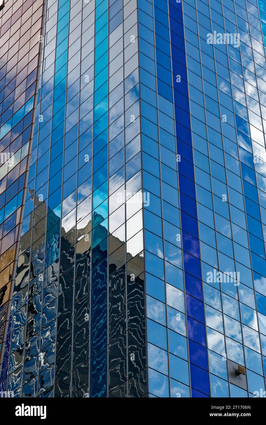 Westin New York at Times Square reflects sky and surroundings in its boldly colored glass curtain walls; stripes accentuate the hotel’s height. Stock Photo