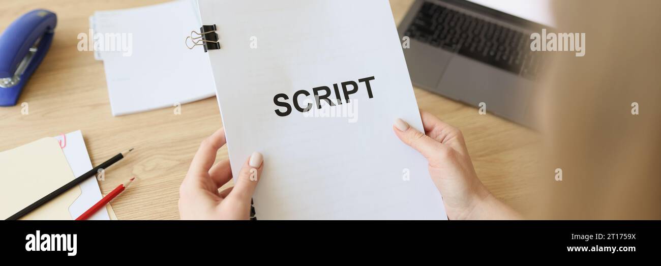 Hands of woman holding script papers for filming TV show. Female ...