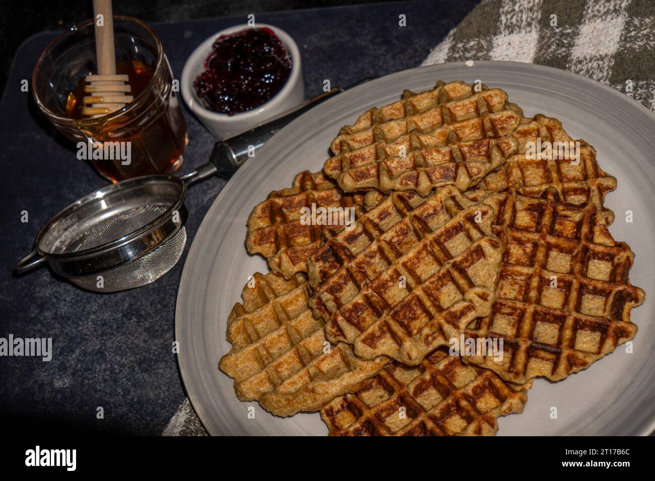 Waffles served with peanut butter and jam. Food menu photography