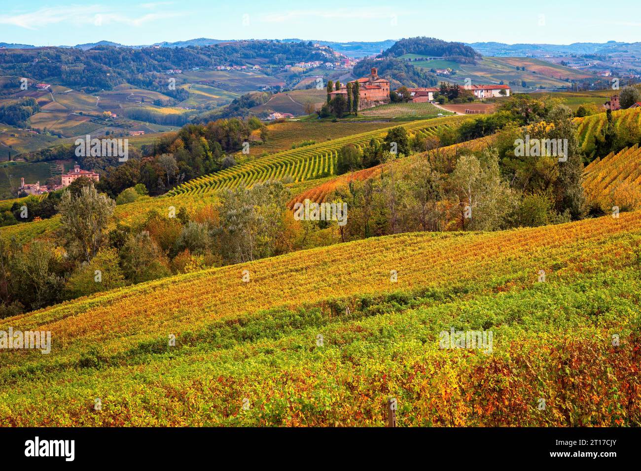 View of the beautiful hills with autumnal vineyards near Barolo in Piedmont, Italy. Stock Photo