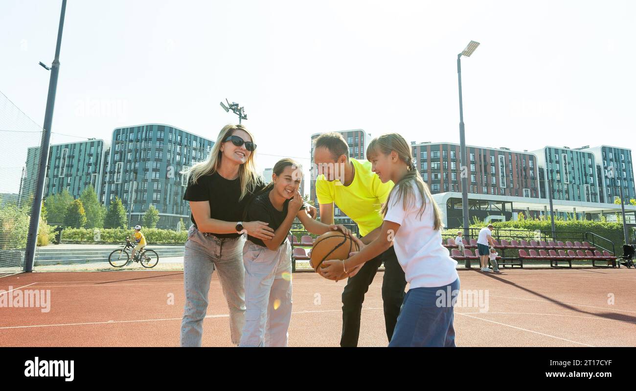 Asian family playing basketball hi-res stock photography and images - Alamy