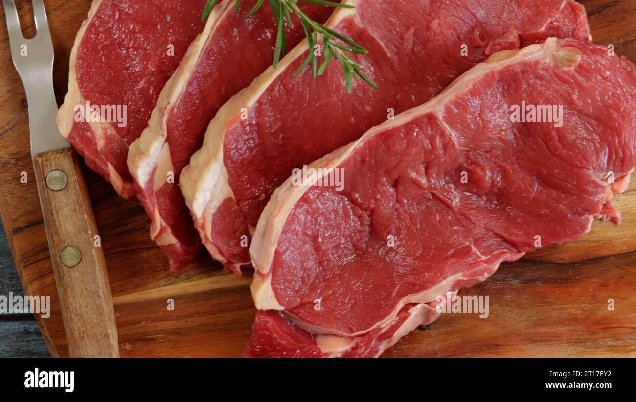 raw beef ribeye close-up on a cutting board Stock Photo