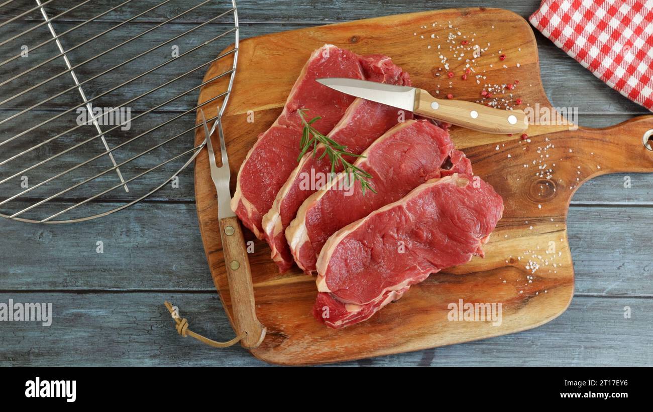 raw beef ribeye close-up on a cutting board Stock Photo