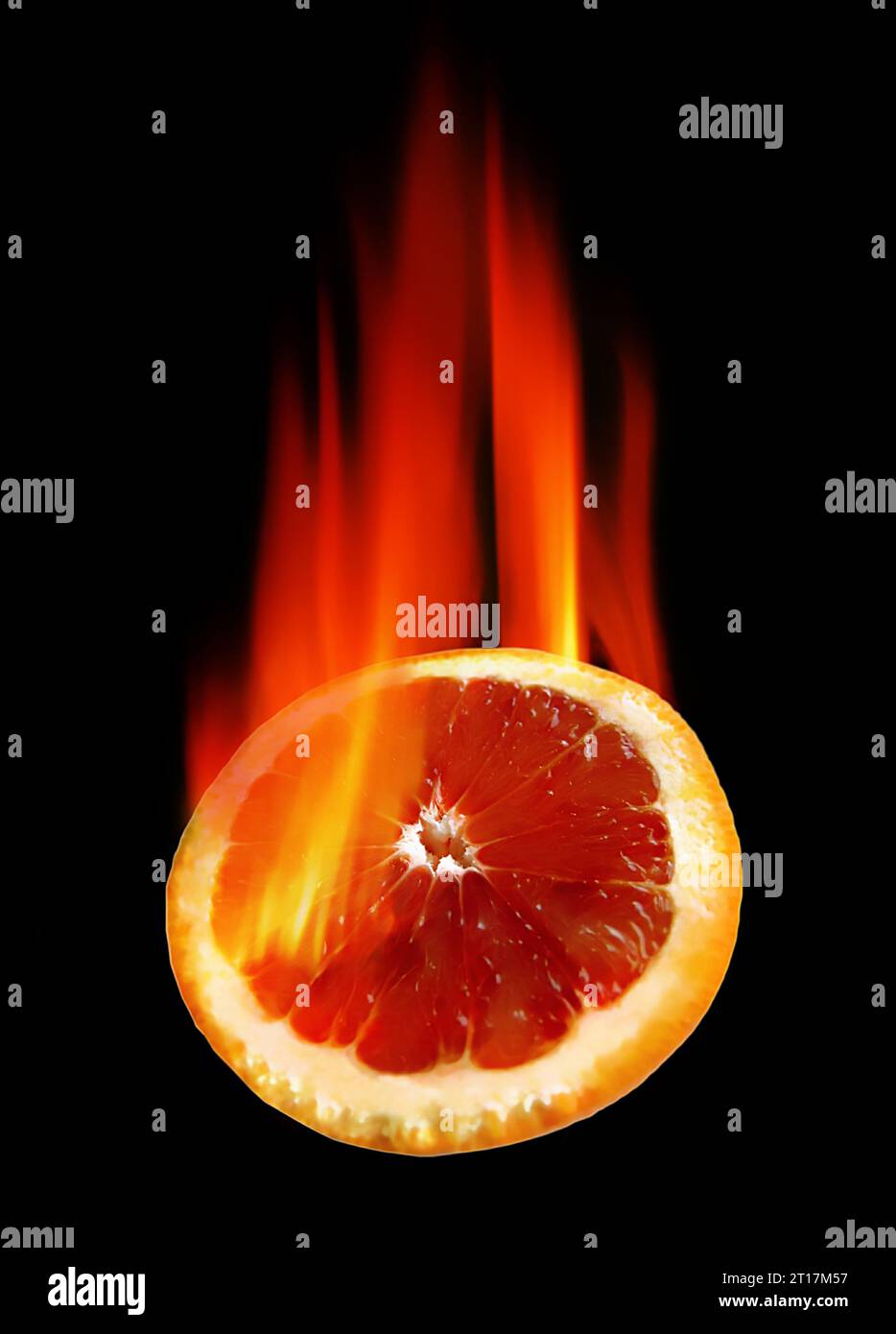 burning orange in hot fire on black background Stock Photo