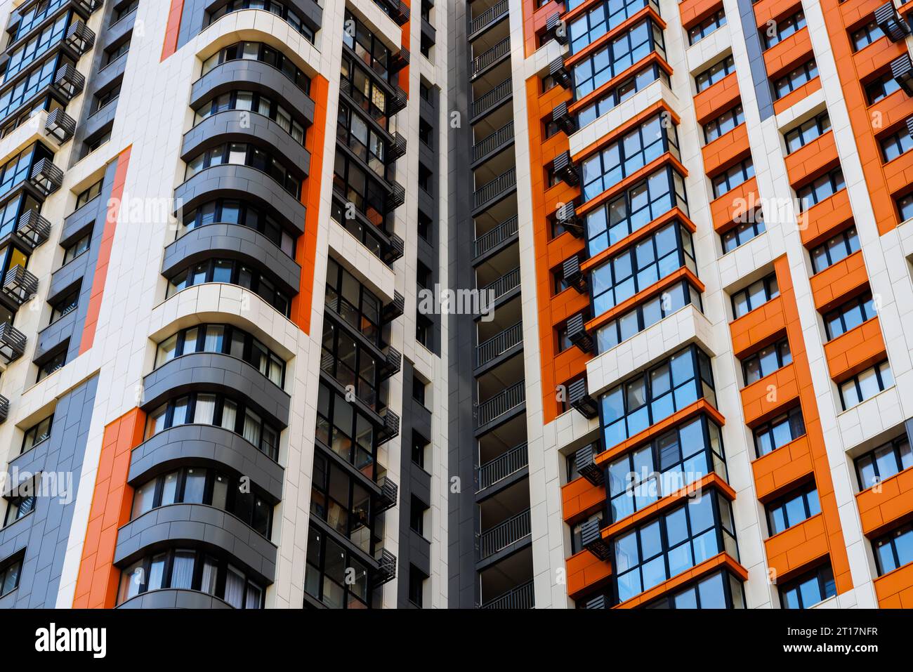 freshly built high rise apartment building on blue sky background with ...