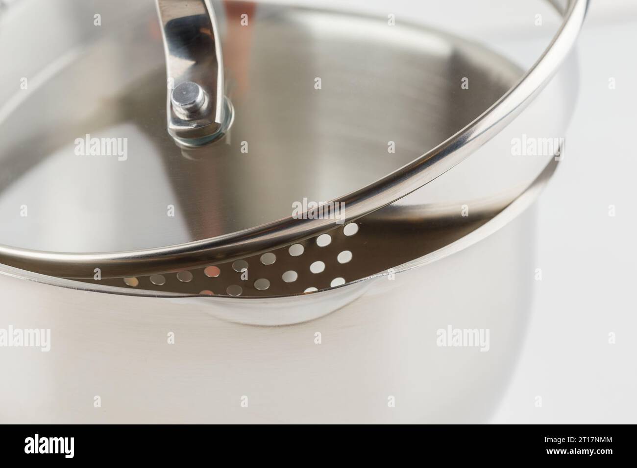 stainless steel cooking pot with glass lid with perforated skirting for