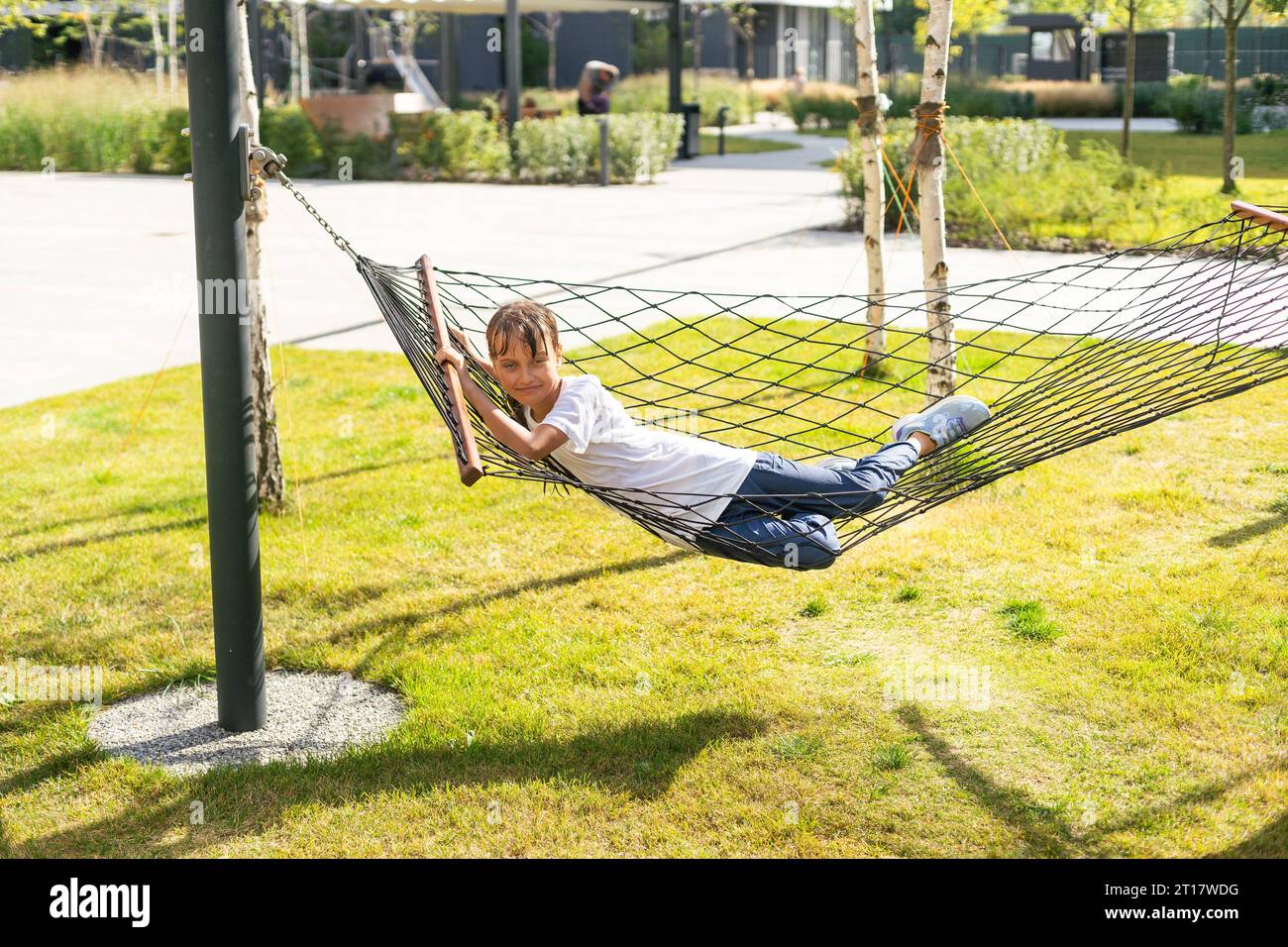 A girl is resting lying in a hammock Stock Photo Alamy