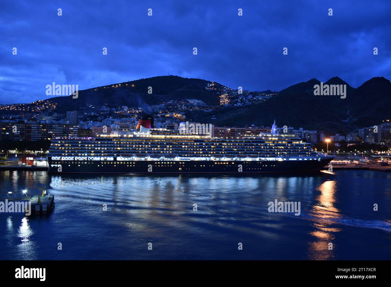 Cruise ship at night in harbour Stock Photo - Alamy