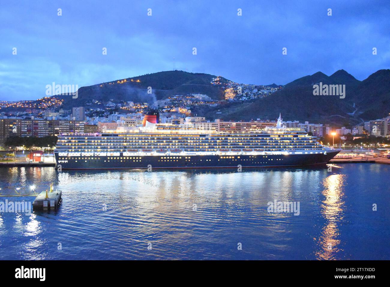 Cruise ship at night in harbour Stock Photo - Alamy