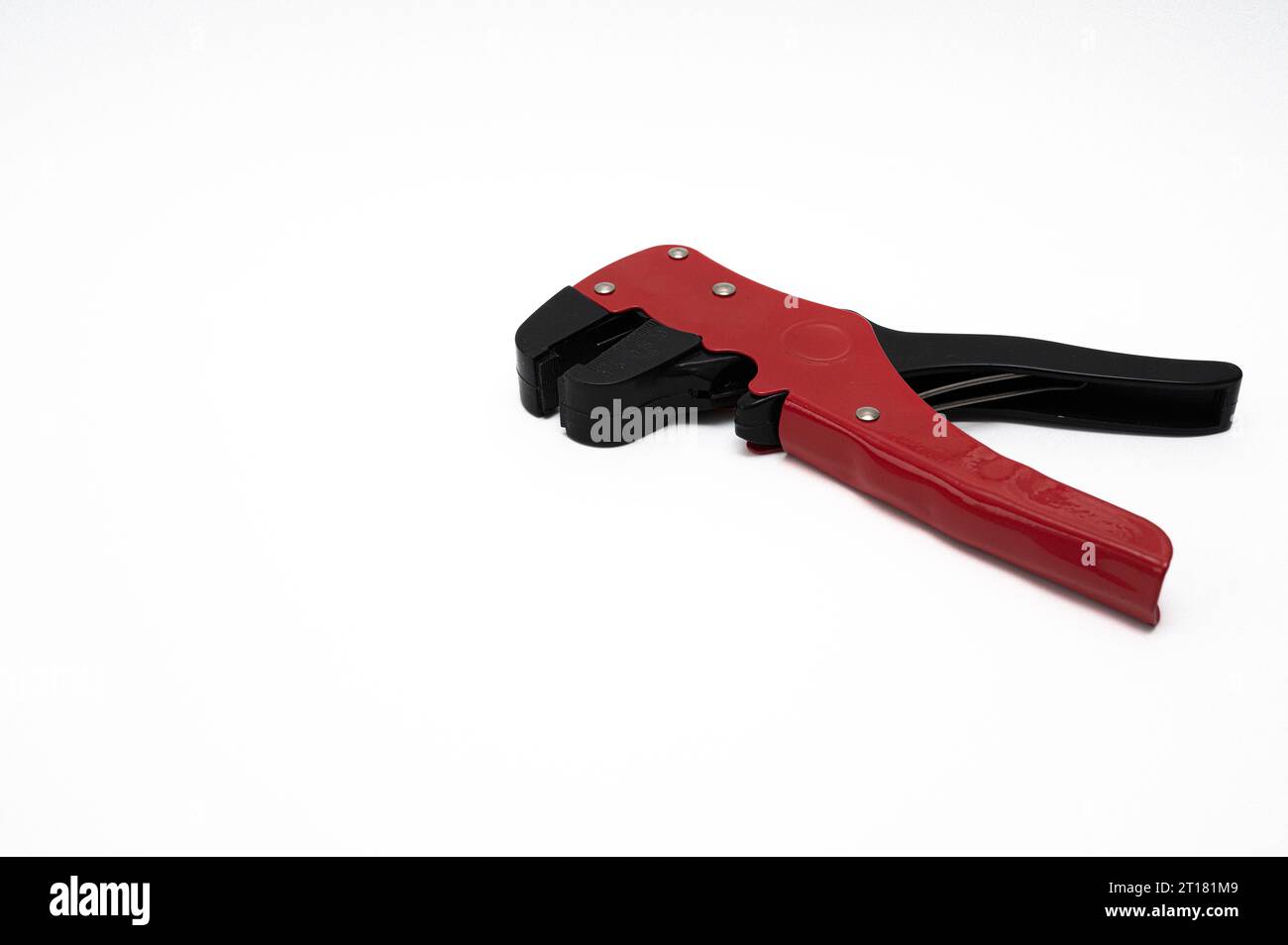 wire stripper with red and black handles isolated on white with copyspace Stock Photo