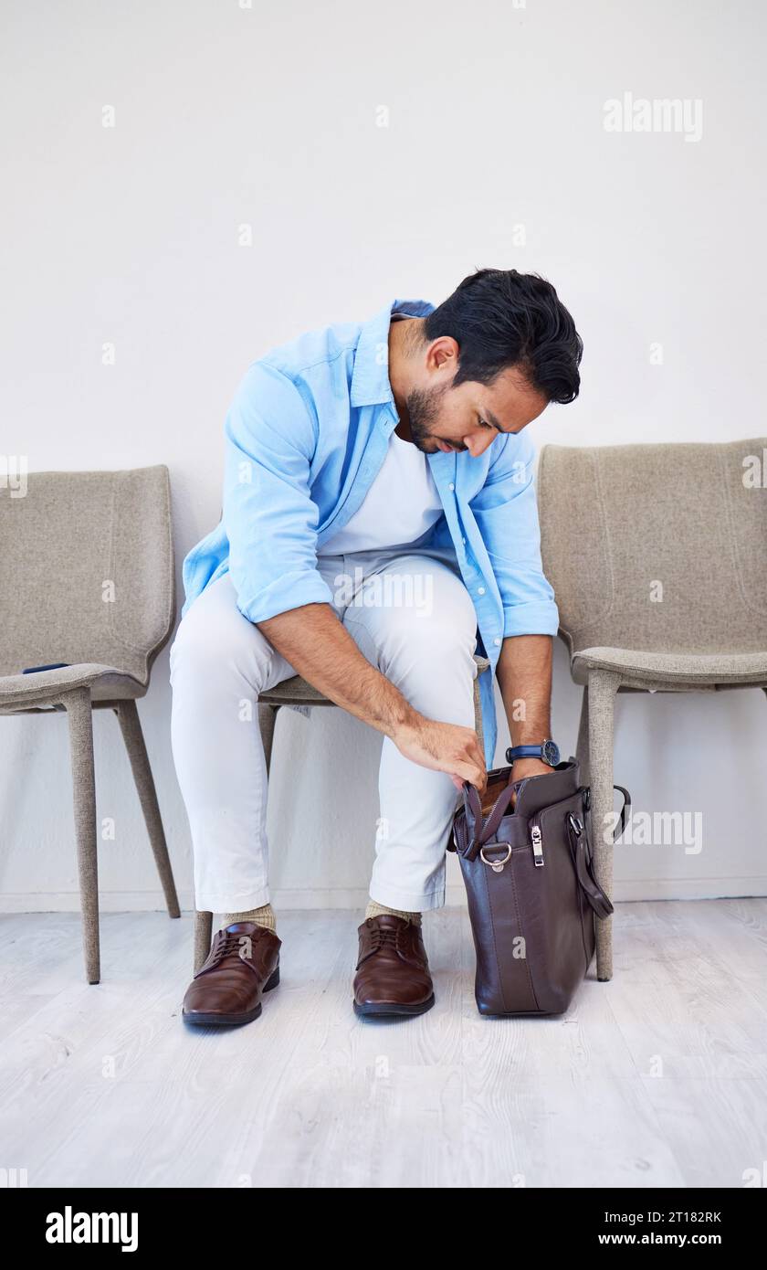 Bag, search and man in waiting room for interview, hiring and