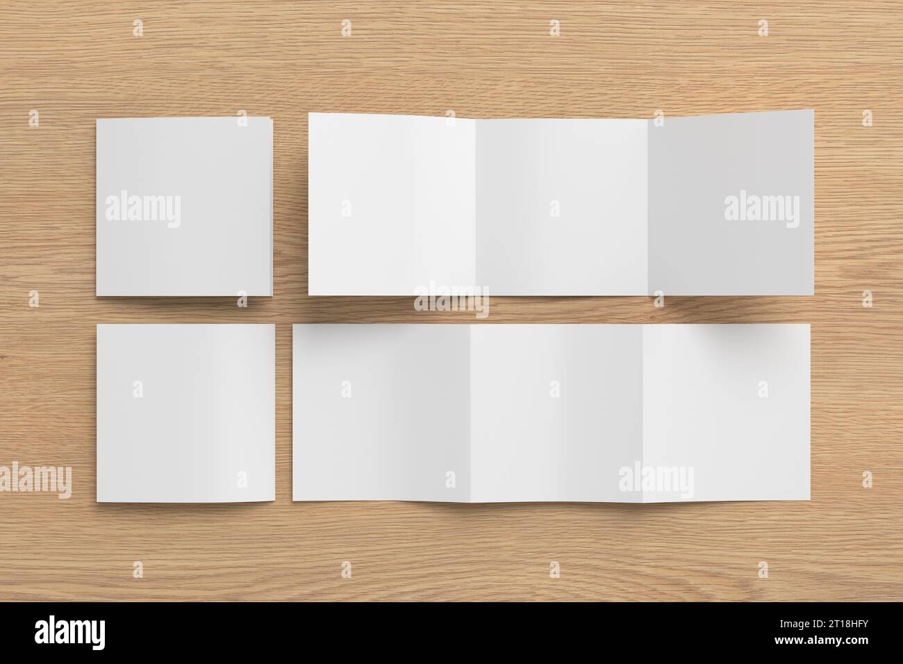 Square trifold roll brochure booklet mockup on wooden background Stock Photo