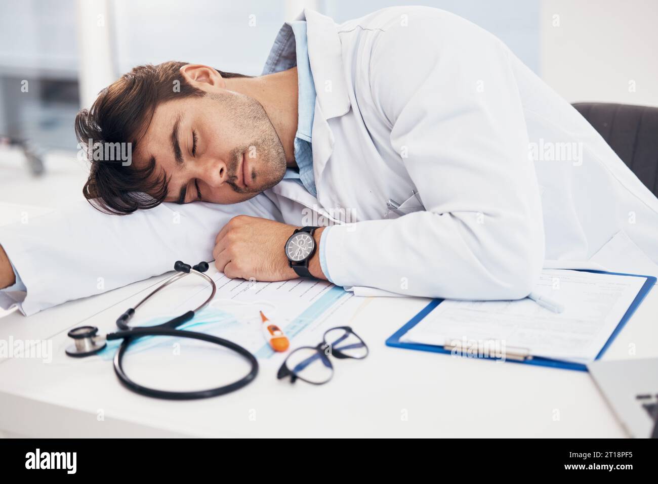Exhausted doctor sleeping workplace hi-res stock photography and images ...