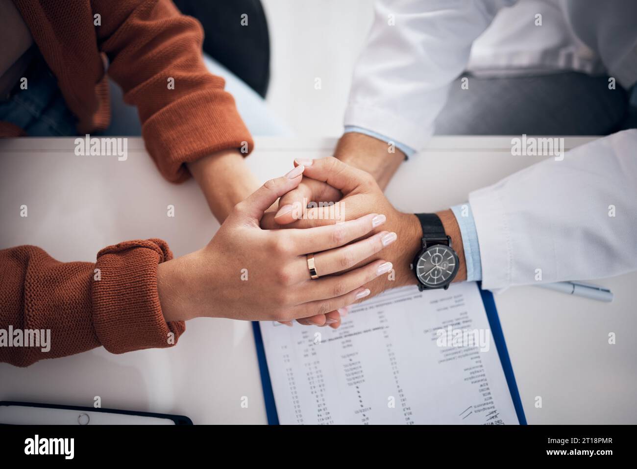 Diagnosis, results and doctor holding hands with patient for support ...