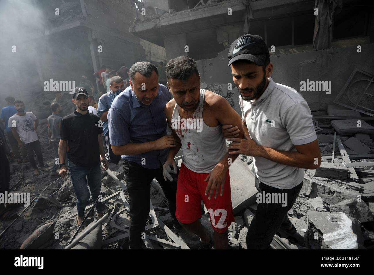 Rafah, Gaza. 12th Oct, 2023. Palestinians Help An Injured Man Following ...