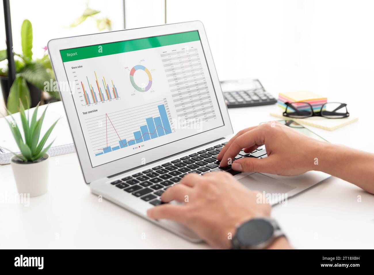 Analyzing data for marketing plan. Business analytics, spreadsheet app on laptop Stock Photo