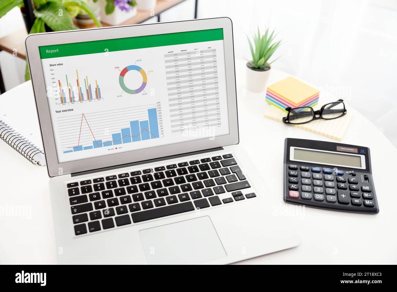 Analyzing data for marketing plan. Business analytics, spreadsheet app on laptop Stock Photo