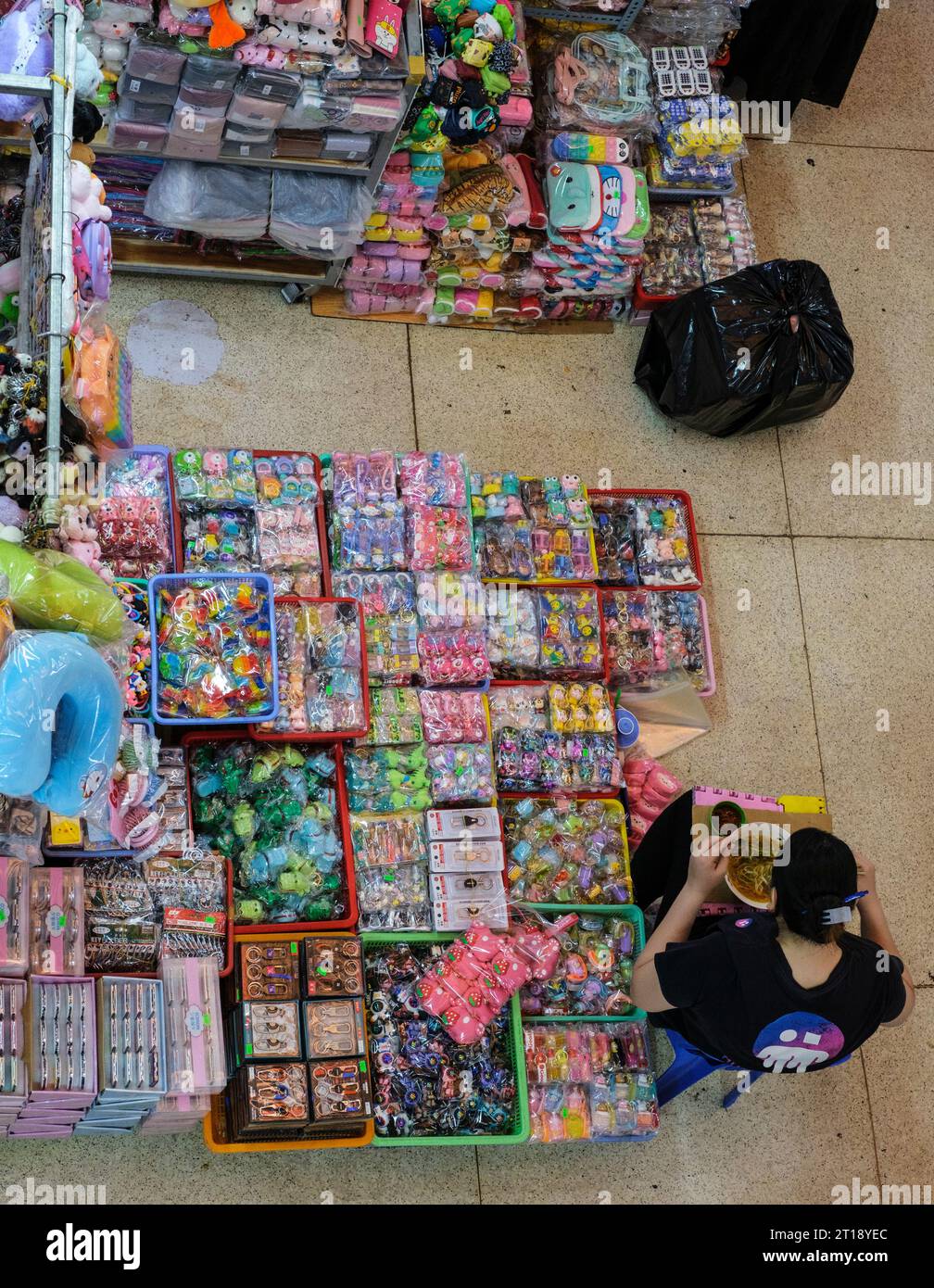 Binh Tay Market Scene, Ho Chi Minh City, Vietnam. Overhead Internal View, Vendor Having Lunch. Stock Photo