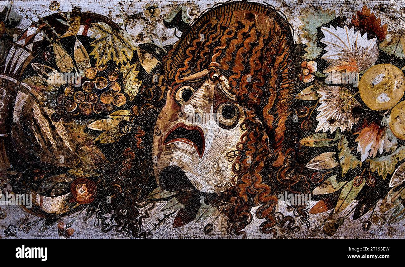 Ancient Roman mosaic of a tragic dramatic mask,  House of the Faun first century BC. mosaic from Pompeii Roman City is located near Naples in the Campania region of Italy. Pompeii was buried under 4-6 m of volcanic ash and pumice in the eruption of Mount Vesuvius in AD 79. Italy, Museum, Naples, Stock Photo