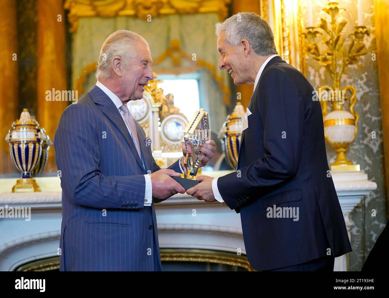 King Charles III talks to guests as he presents the 2022 and 2023 Queen(02)