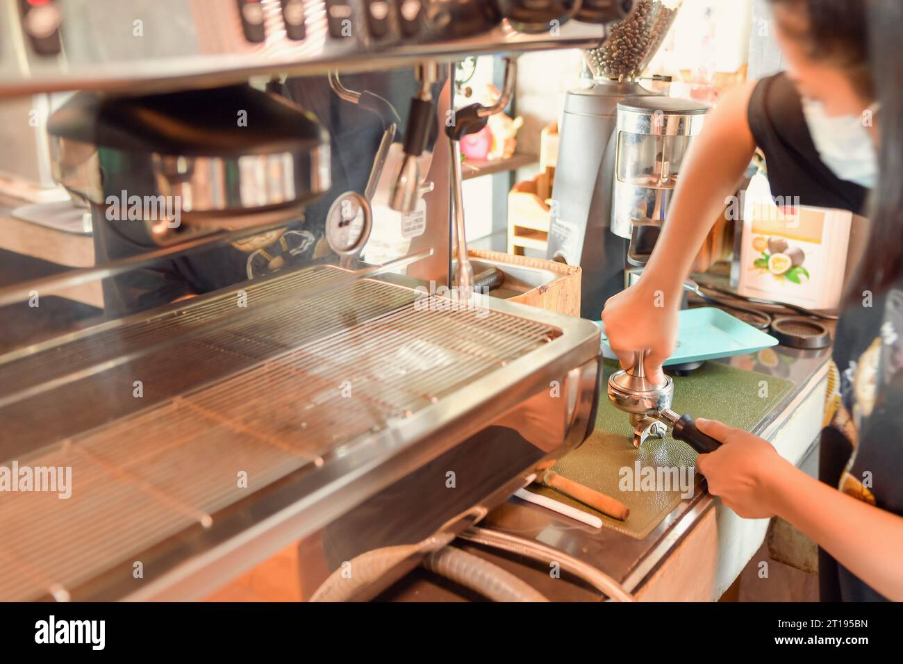 Close-up of a Barista making a coffee in a cafe Stock Photo