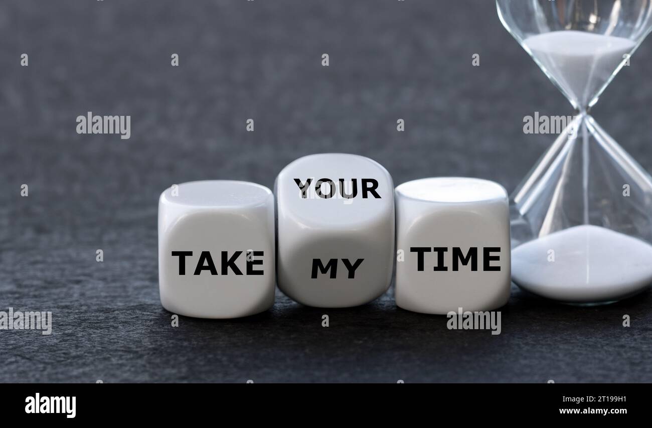 Dice form the expression 'take my time' and 'take your time'. Stock Photo