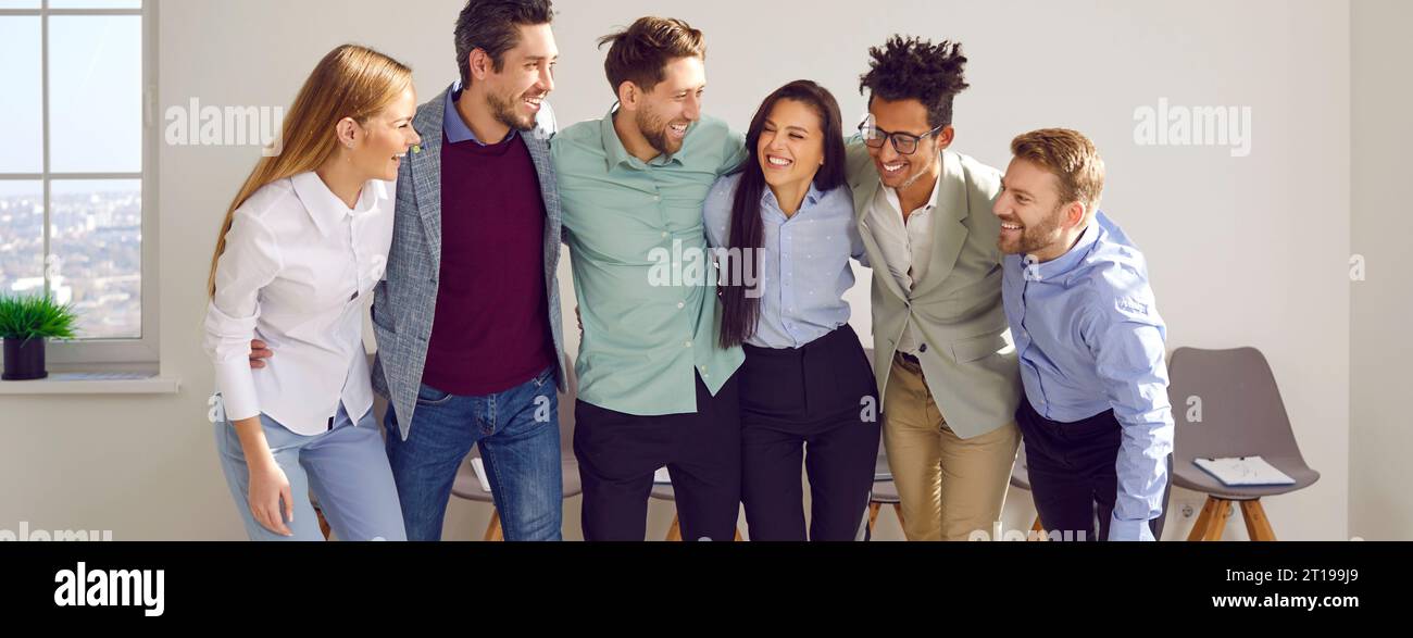 Banner with a happy diverse business team standing in the office ...