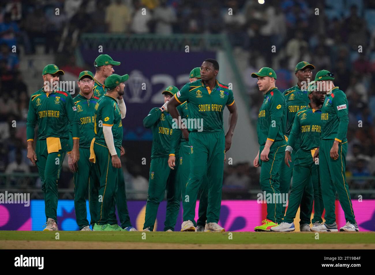 South African cricketers watch the screen for a review of the wicket of ...
