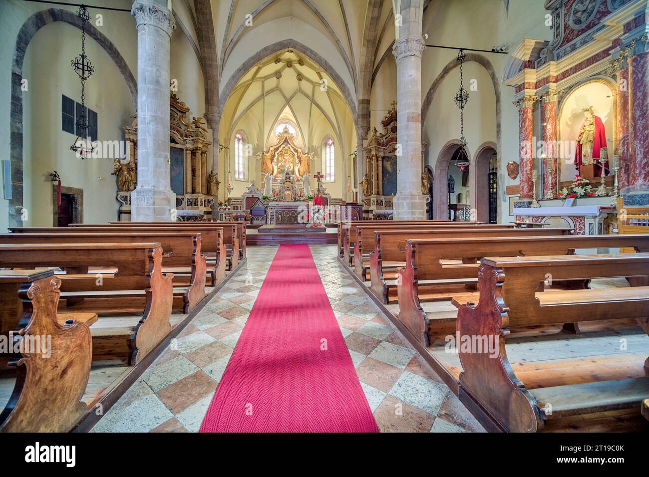 Interior design and altar inside the church Basilica dei Santi Martiri dell'Anaunia. Stock Photo