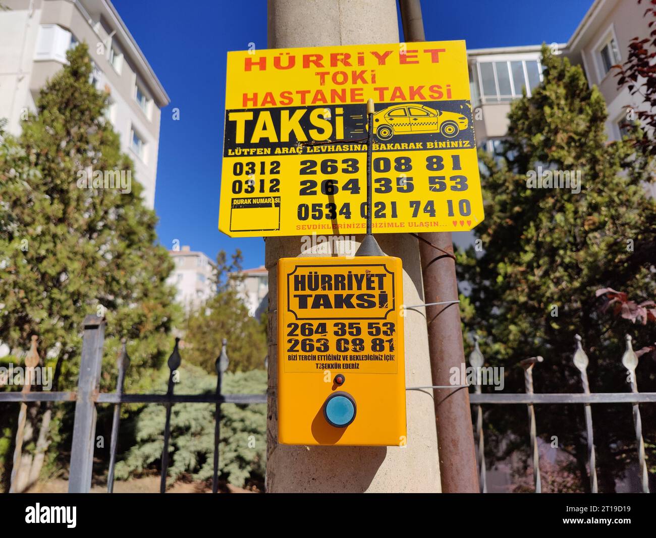 Ankara, Turkey, October 12, 2023: Yellow sign with taxi call button and taxi phones in Turkey. Stock Photo