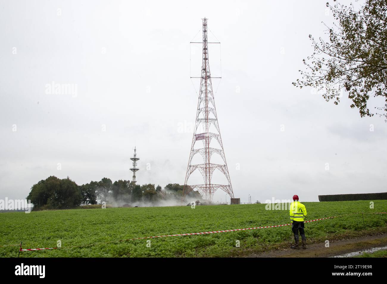 Illustration picture shows the first attempt of the explosive demolition of a former NATO antenna in Court-Saint-Etienne, Thursday 12 October 2023. This NATO antenna is located in a particularly sensitive area including: a high pressure gas pipe, a antenna of the Astrid network as well as a drinking water tank. Higher than the Atomium, it measures 162 m high. Dating from the 1950s, this tower was equipped with NATO protection and detection radars. Technologies like satellites have made it obsolete. BELGA PHOTO NICOLAS MAETERLINCK Stock Photo