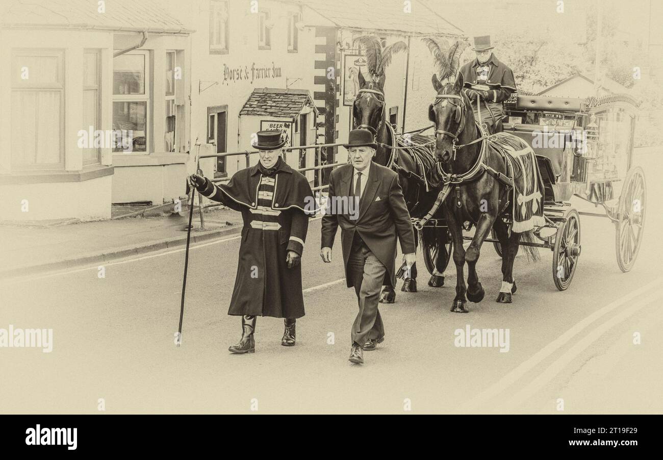 Funeral cortège with the funeral director leading a Victorian glass