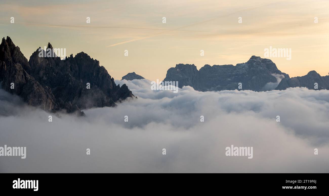 Mountain landscape with fog, at sunset Dolomites Italy Stock Photo - Alamy