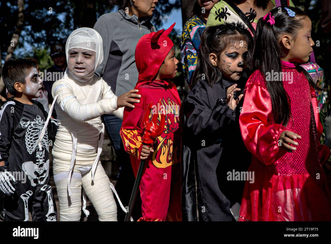 Children dressed in halloween costumes parade at the start of the Day of the Dead festival known in Spanish as Día de Muertos, October 30, 2013 in Oaxaca, Mexico. Stock Photo