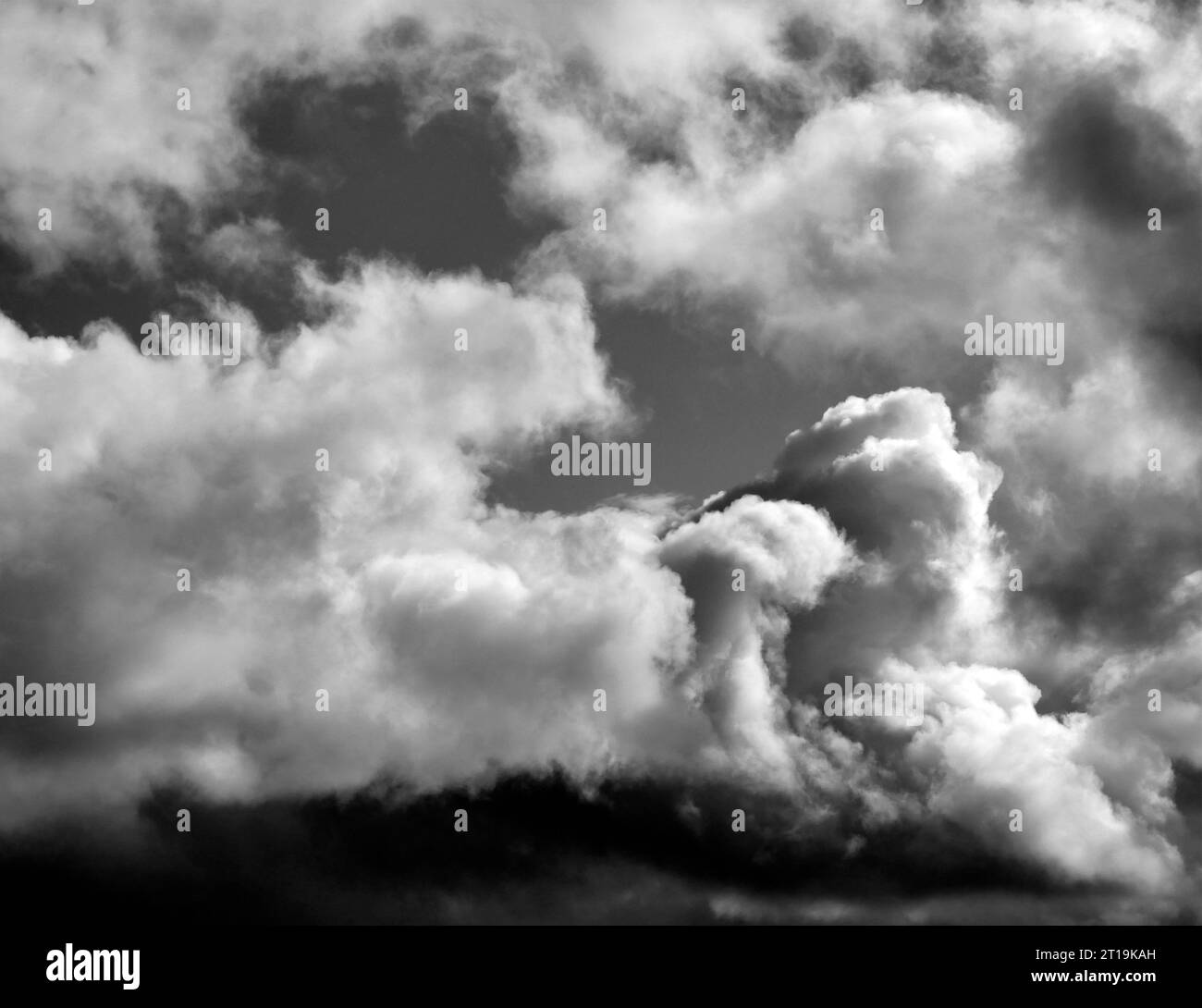 Black and White Beautiful sky with fluffy white clouds over modern city background, cloudscape wallpaper Stock Photo