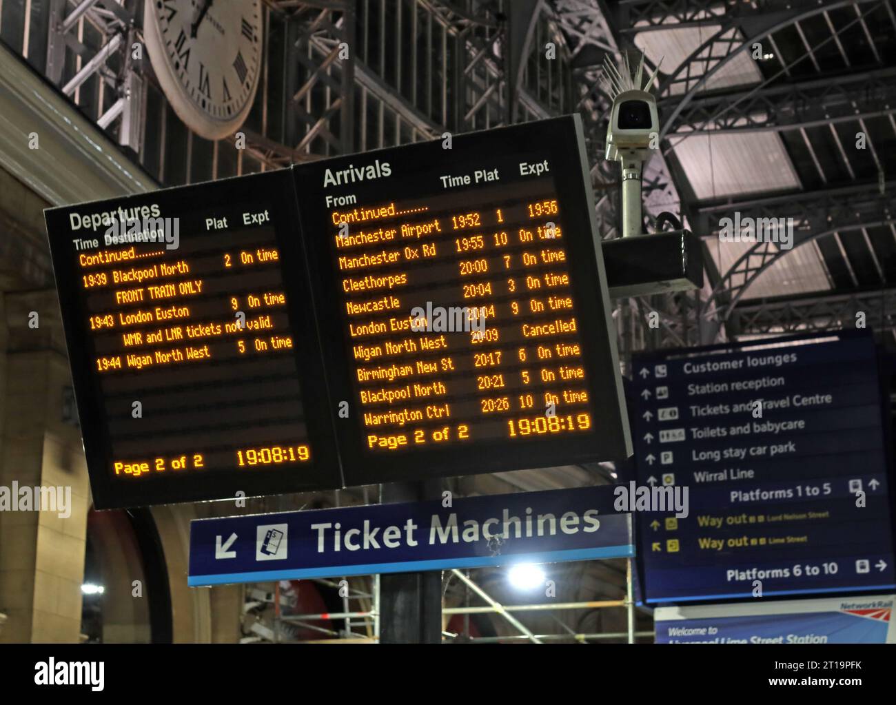 Evening departures and arrivals board and ticket machines, at Lime St, Liverpool, Merseyside, England, UK,,L1 1JD Stock Photo
